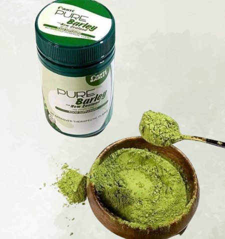 Santé Pure Barley canister with a bowl of barley grass powder